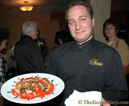 waiter serving Sante Ristorante appetizers